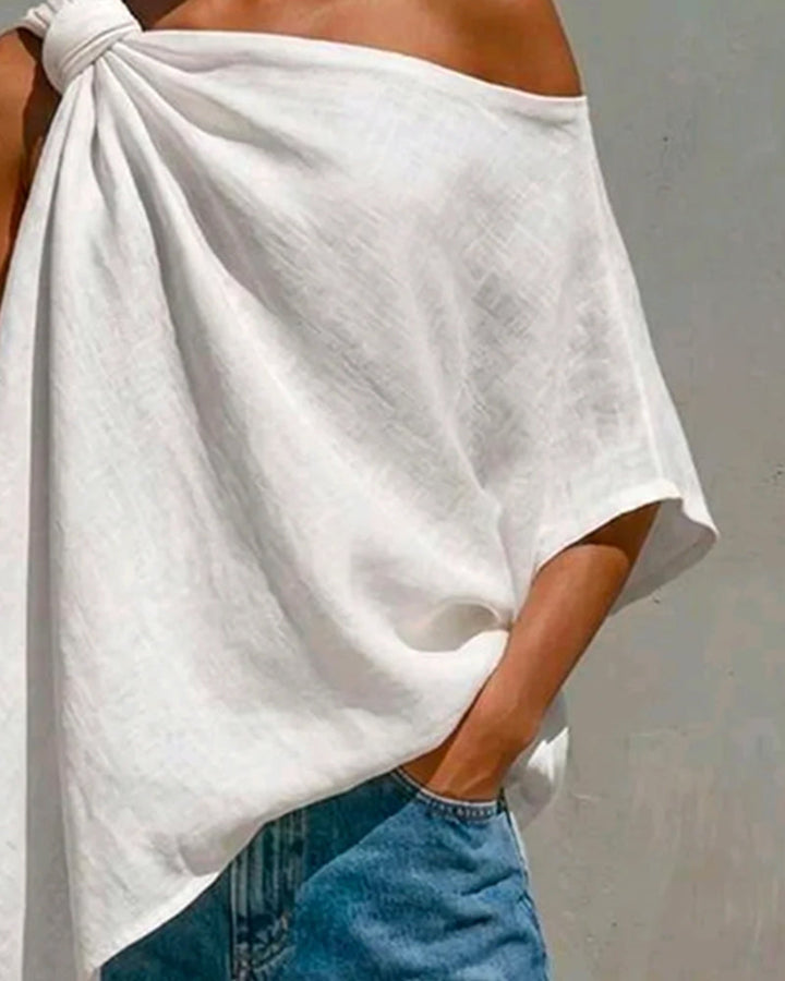 Blusa de un solo hombro con nudo asimétrico