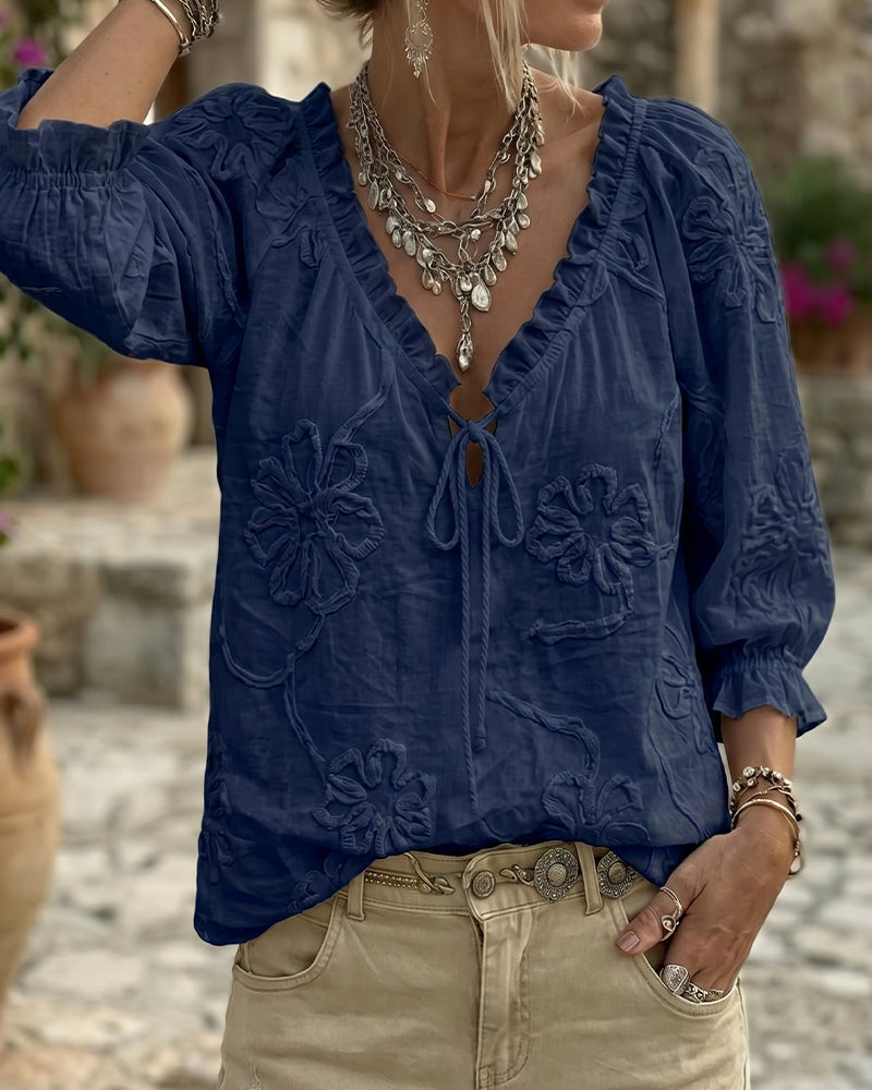 Blusa de algodón 100%, escote en V envolvente, con lazo y volantes