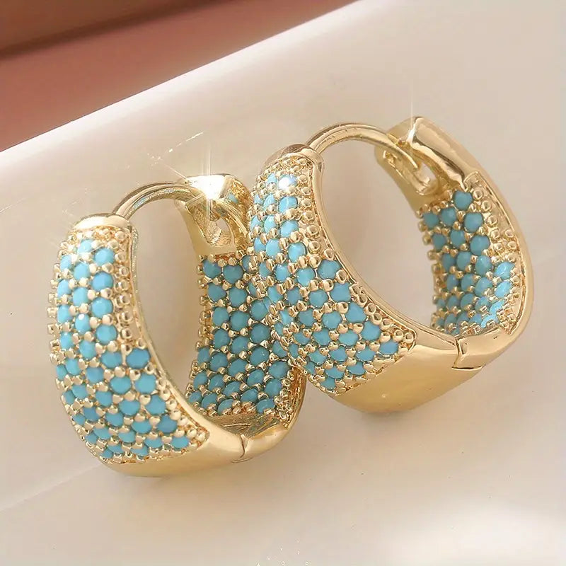 Elegantes aros de oro con perlas turquesas