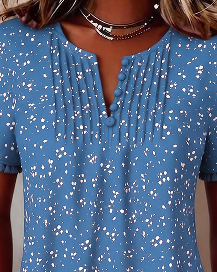 Blusa blanca de punto con flecos y mangas cortas