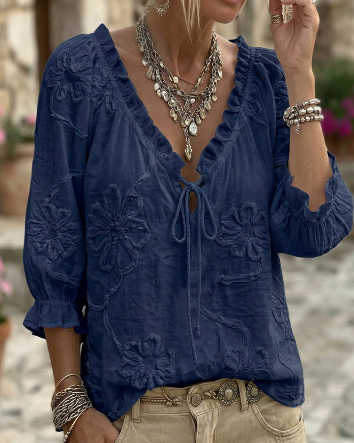 Blusa de algodón 100%, escote en V envolvente, con lazo y volantes