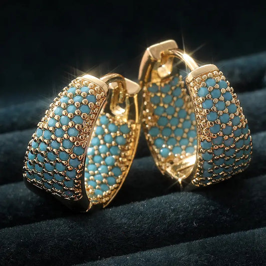 Elegantes aros de oro con perlas turquesas