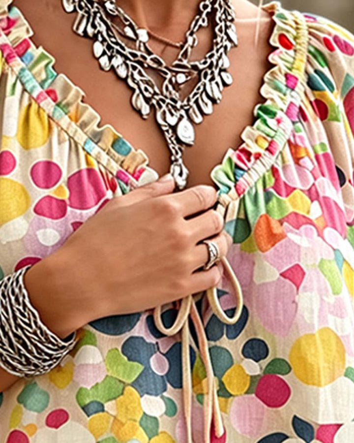 Blusa de escote en V con lunares y lazos