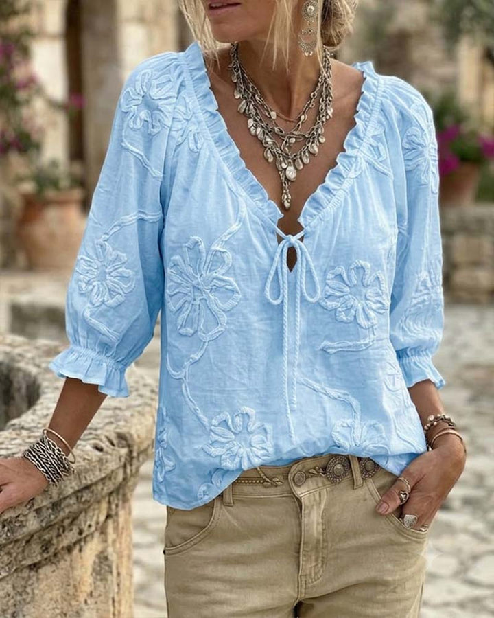 Blusa de algodón 100%, escote en V envolvente, con lazo y volantes