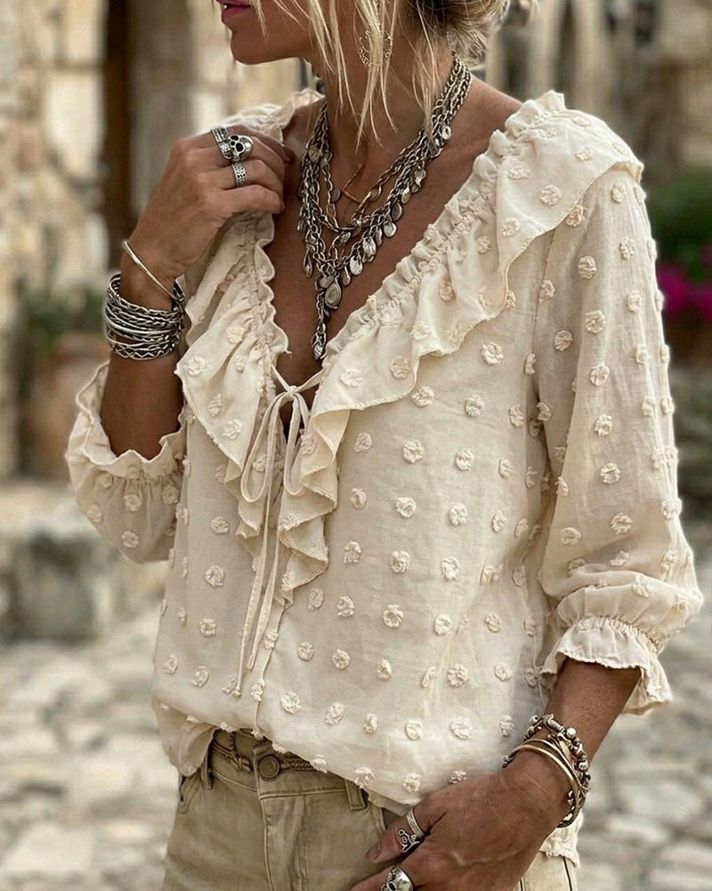 Blusa de jacquard con lunares y mangas globo, escote en V