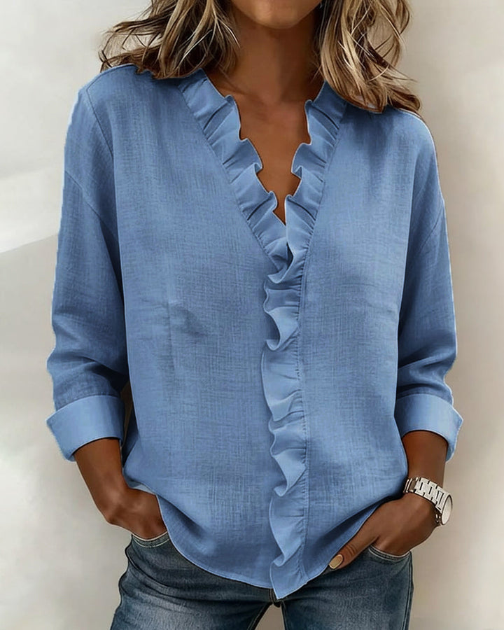 Blusa de manga larga con volantes y escote en V