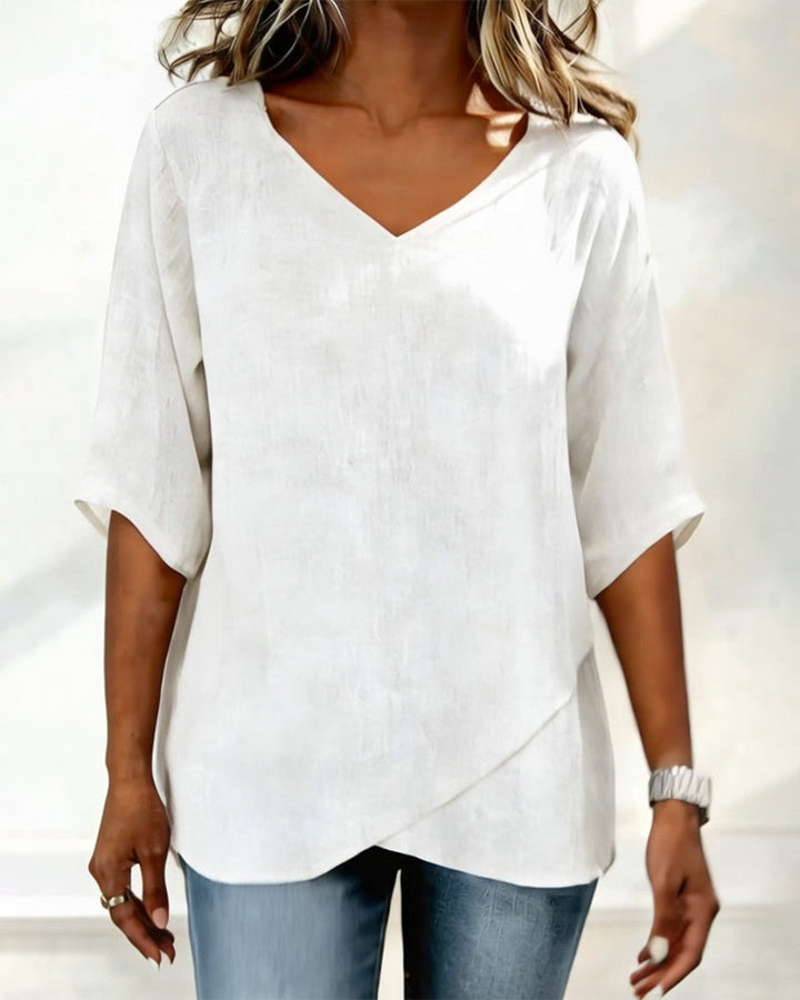 Top con dobladillo irregular, color liso, cuello en V