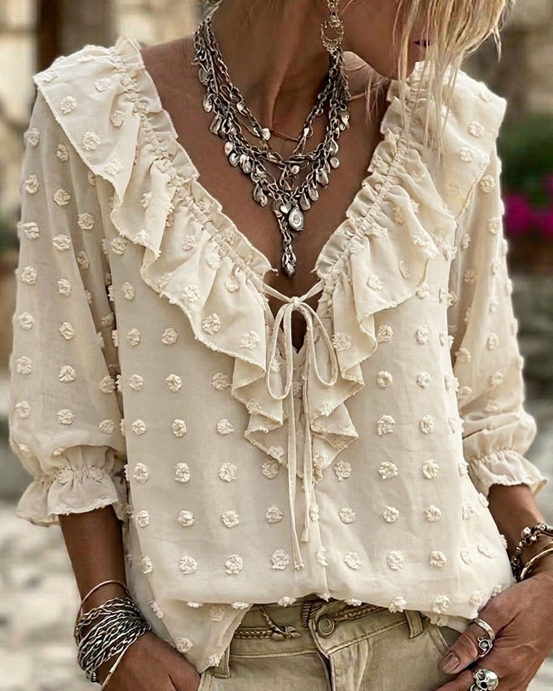 Blusa de jacquard con lunares y mangas globo, escote en V