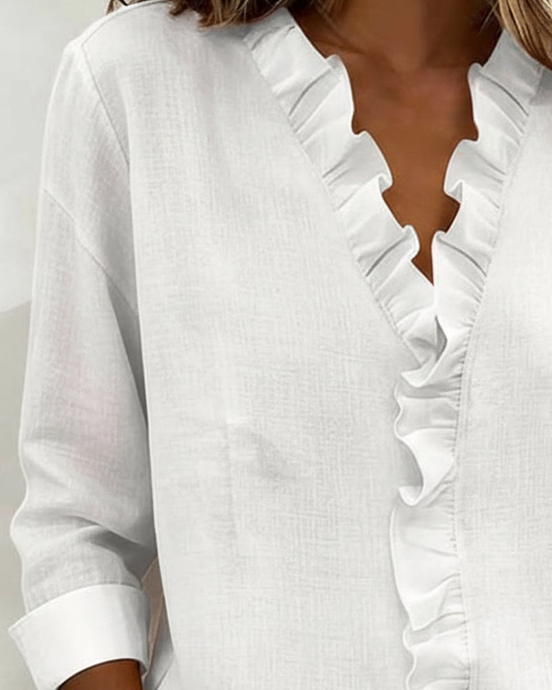 Blusa de manga larga con volantes y escote en V