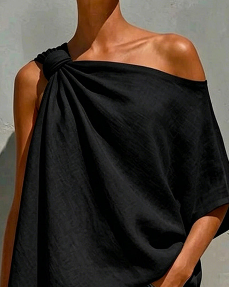 Blusa de un solo hombro con nudo asimétrico