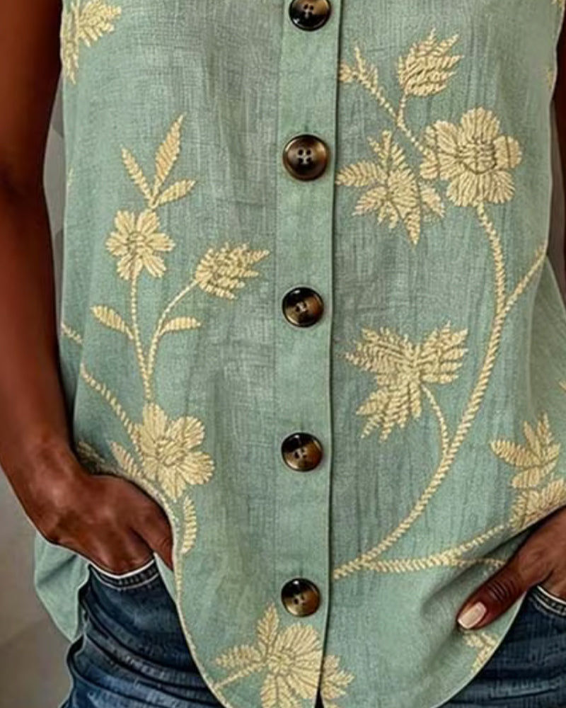 Top sin mangas floral con aro metálico