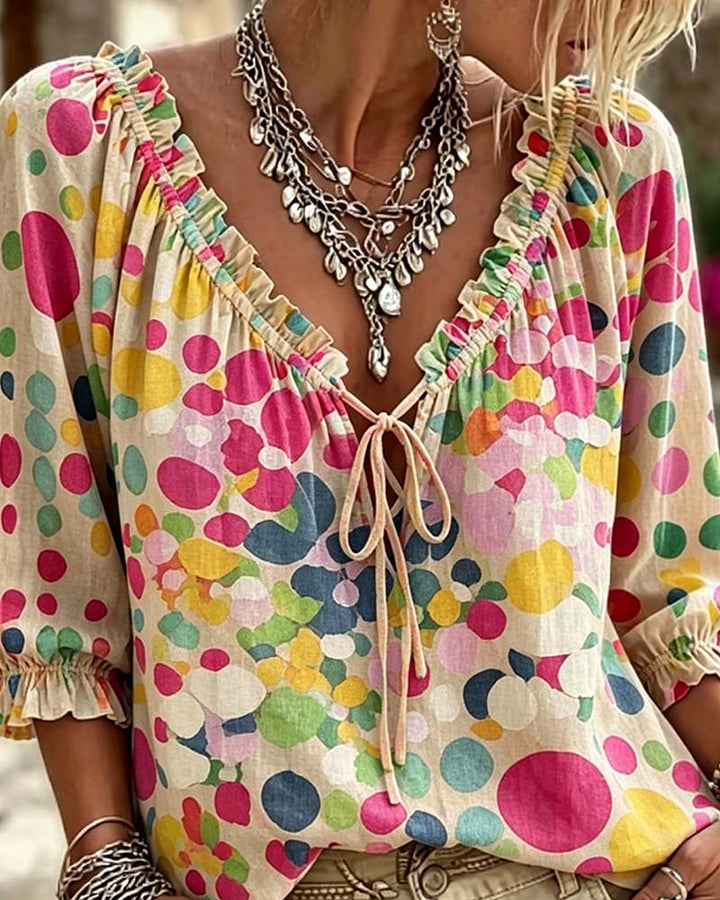 Blusa de escote en V con lunares y lazos