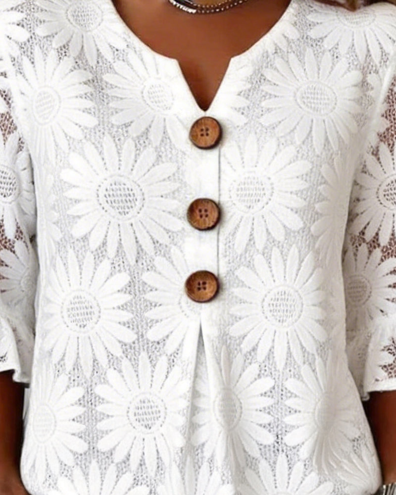 Blusa con estampado de margaritas y mangas con volantes