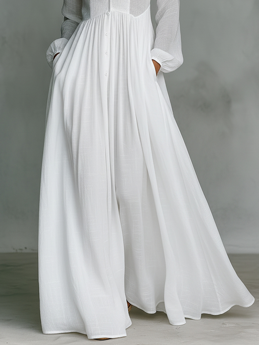 Vestido maxi minimalista en algodón y lino con patchwork, cuello alto y mangas largas